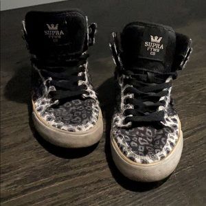 White and black Supra High Tops